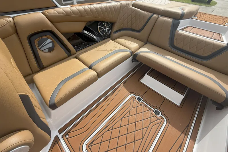 Slide: The Image of 2017 Tigé RZX2 boat interior with tan leather seats and stylish flooring. - 38