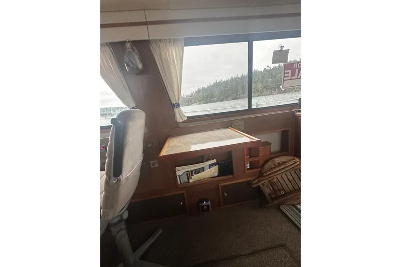Slide: The Image of Interior of a 1982 Campion 310 boat with view. - 11