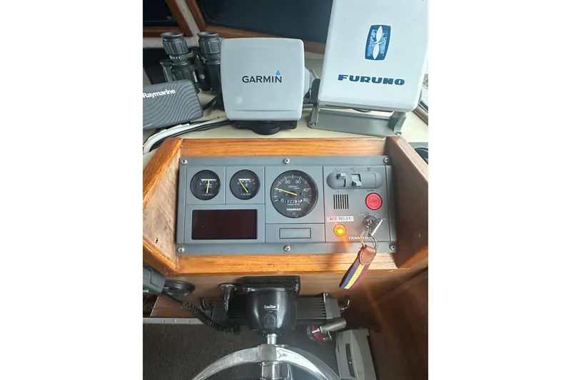 Slide: The Image of Control panel of a 1982 Campion 310 boat with Garmin and Furuno equipment. - 16