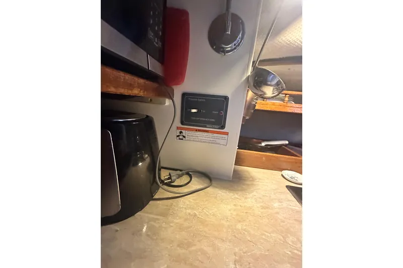 Slide: The Image of Interior of 1982 Campion 310 boat with kitchen appliances and control panel. - 27