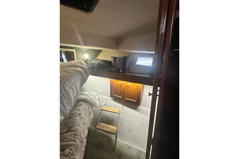 Slide: The Image of Interior of 1982 Campion 310 boat with bunk beds and wooden cabinetry. - 29