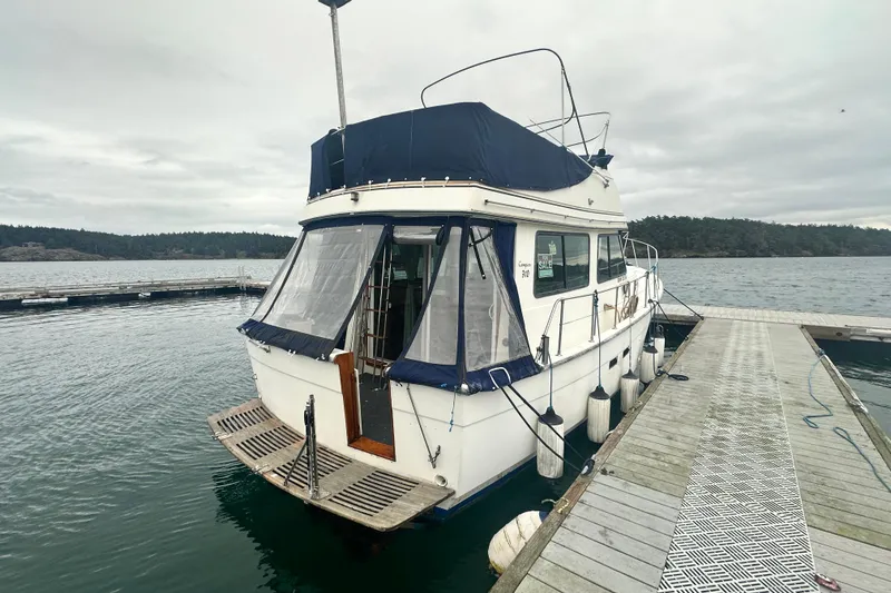 Slide: The Image of 1982 Campion 310 boat docked at marina with overcast sky. - 3