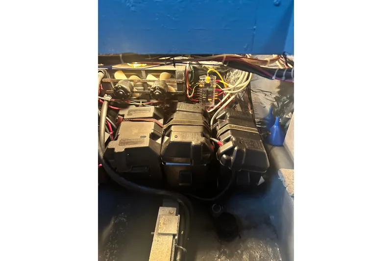 Slide: The Image of 1982 Campion 310 engine compartment with wiring and components visible. - 39