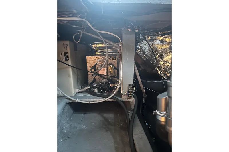 Slide: The Image of Engine compartment of a 1982 Campion 310 boat, showing wiring and components. - 42