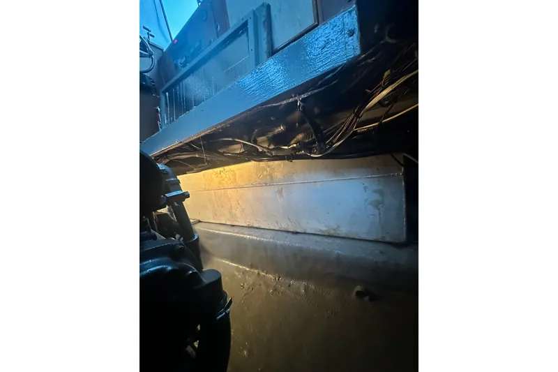 Slide: The Image of Interior view of a 1982 Campion 310 boat, showcasing wiring and structural components. - 44