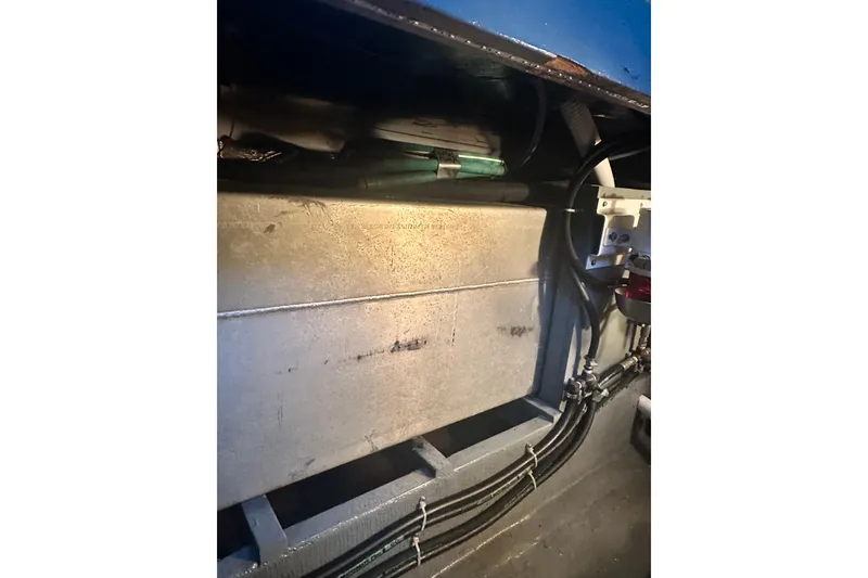 Slide: The Image of 1982 Campion 310 boat interior showing engine compartment and wiring. - 47