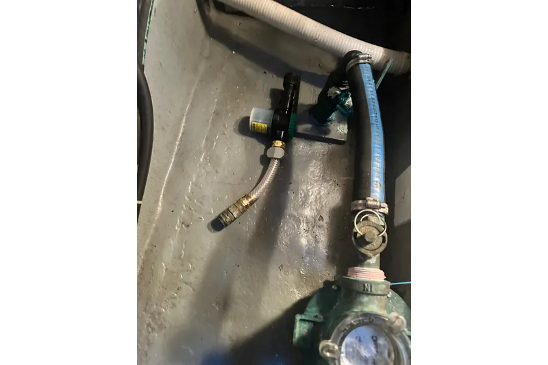 Slide: The Image of Bilge area of 1982 Campion 310 boat showing hoses and fittings. - 49