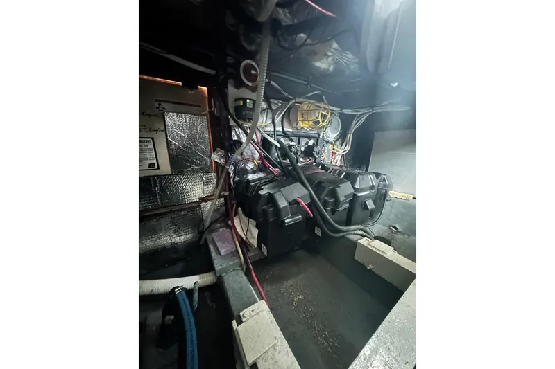 Slide: The Image of Engine compartment of a 1982 Campion 310 boat, showing wiring and components. - 51
