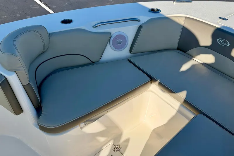 Slide: The Image of 2023 Key West 263 FS boat interior seating with storage compartment. - 12