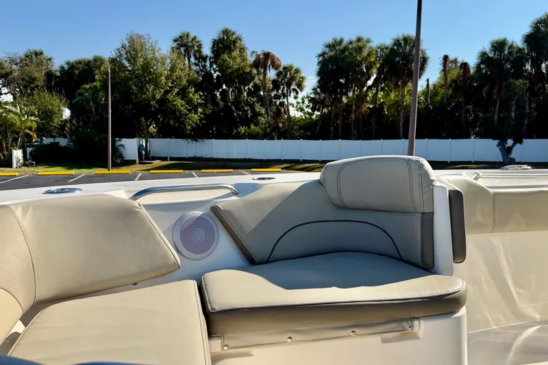 Slide: The Image of 2023 Key West 263 FS boat interior with comfortable seating and speaker. - 15