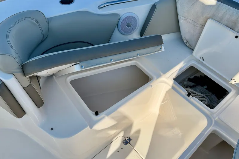 Slide: The Image of 2023 Key West 263 FS boat interior with storage compartments and seating. - 17