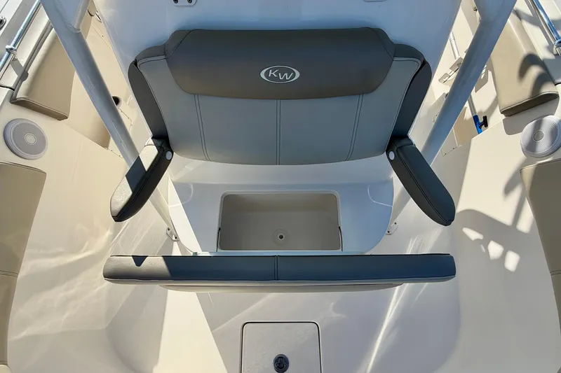 Slide: The Image of 2023 Key West 263 FS boat seating area with storage compartment. - 20