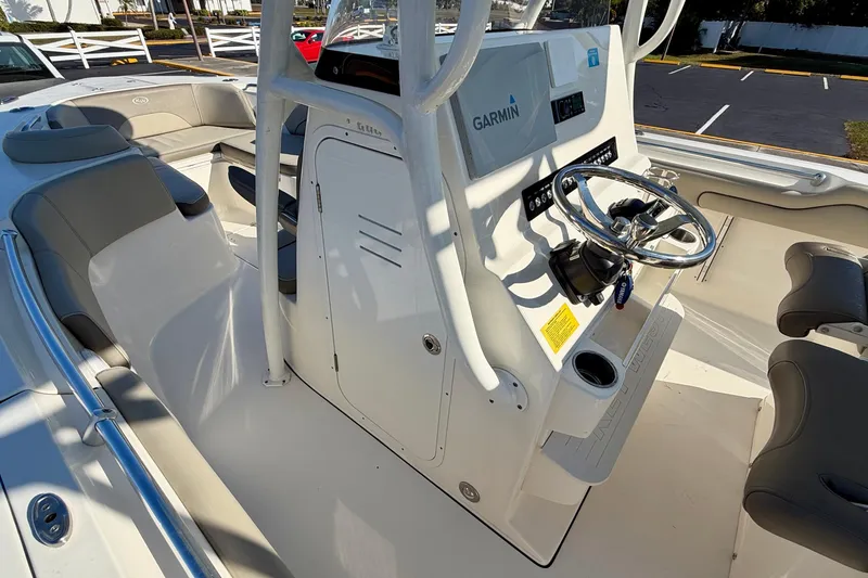 Slide: The Image of 2023 Key West 263 FS boat interior with Garmin navigation and sleek seating. - 22