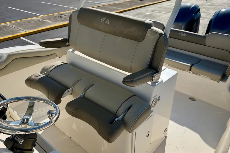Slide: The Image of 2023 Key West 263 FS boat interior with steering wheel and seating. - 25