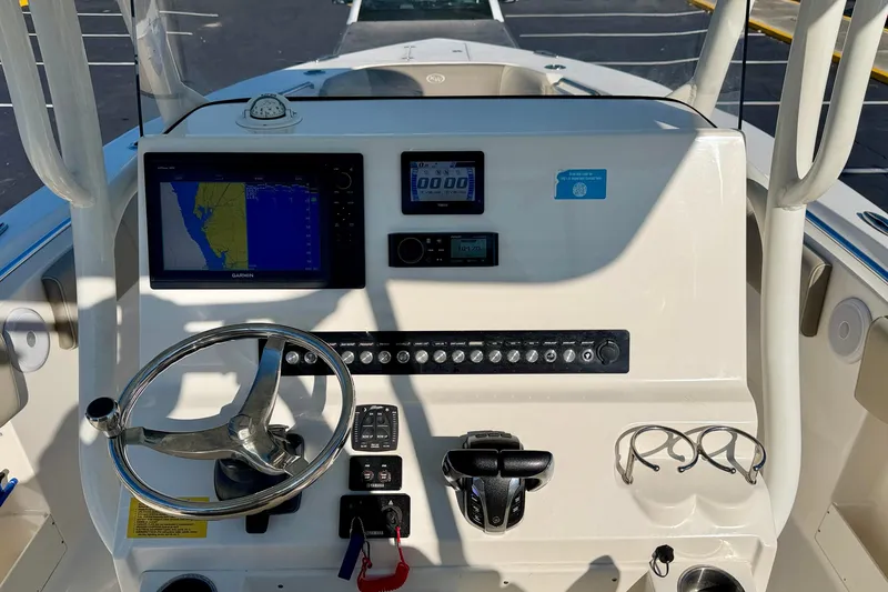 Slide: The Image of 2023 Key West 263 FS boat dashboard with navigation and control systems. - 29