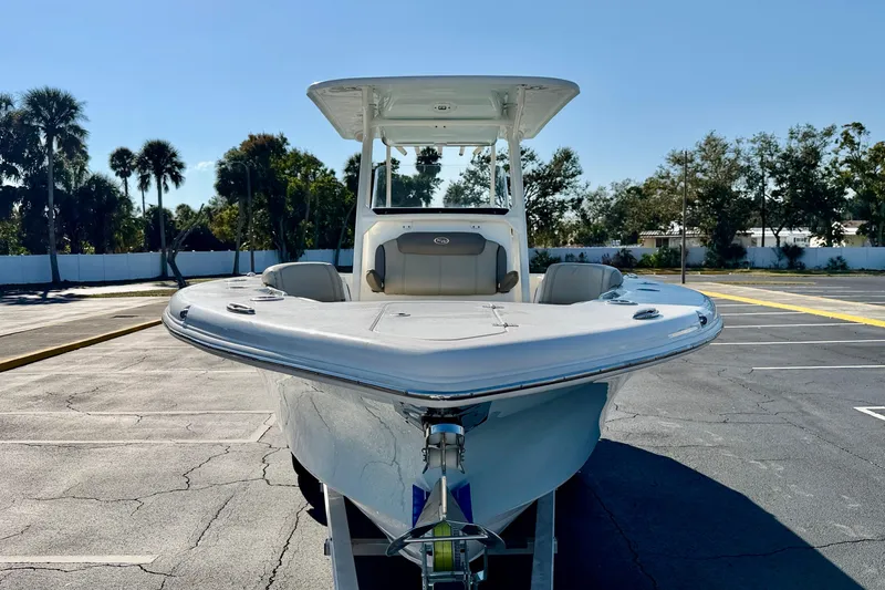 Slide: The Image of 2023 Key West 263 FS boat in parking lot, front view with clear sky. - 3