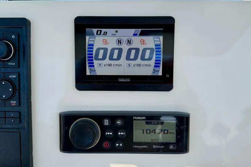 Slide: The Image of Dashboard of 2023 Key West 263 FS boat with Yamaha display and Fusion radio. - 31