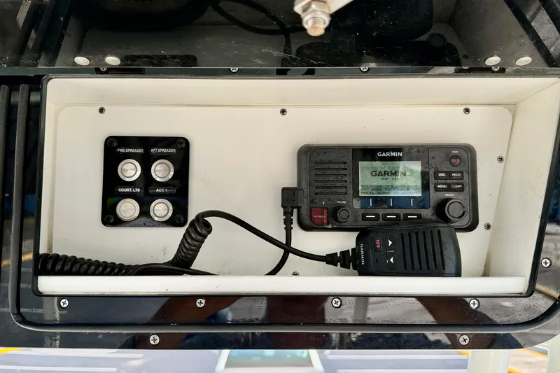 Slide: The Image of 2023 Key West 263 FS boat dashboard with Garmin radio and control panel. - 42