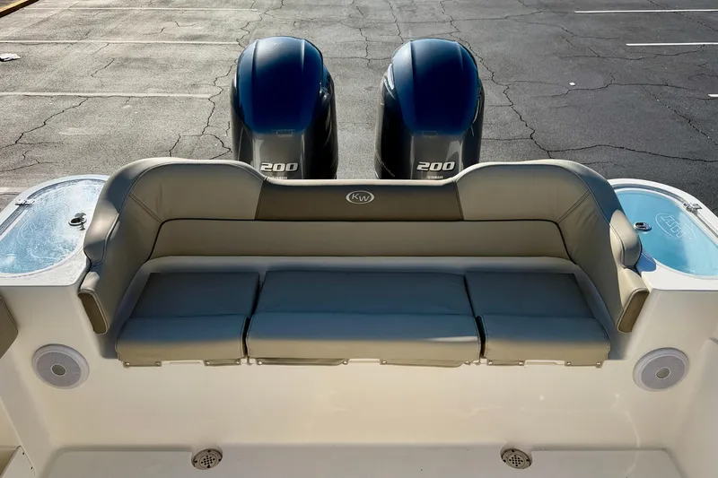 Slide: The Image of 2023 Key West 263 FS boat with dual 200 horsepower engines and cushioned seating. - 46
