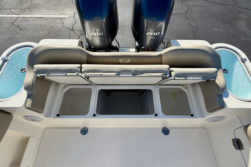 Slide: The Image of 2023 Key West 263 FS boat with dual Yamaha 200 engines, rear seating, and storage compartments. - 48
