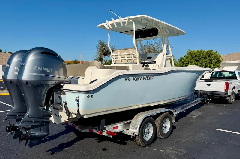 Slide: The Image of 2023 Key West 263 FS boat on trailer with dual Yamaha engines. - 5