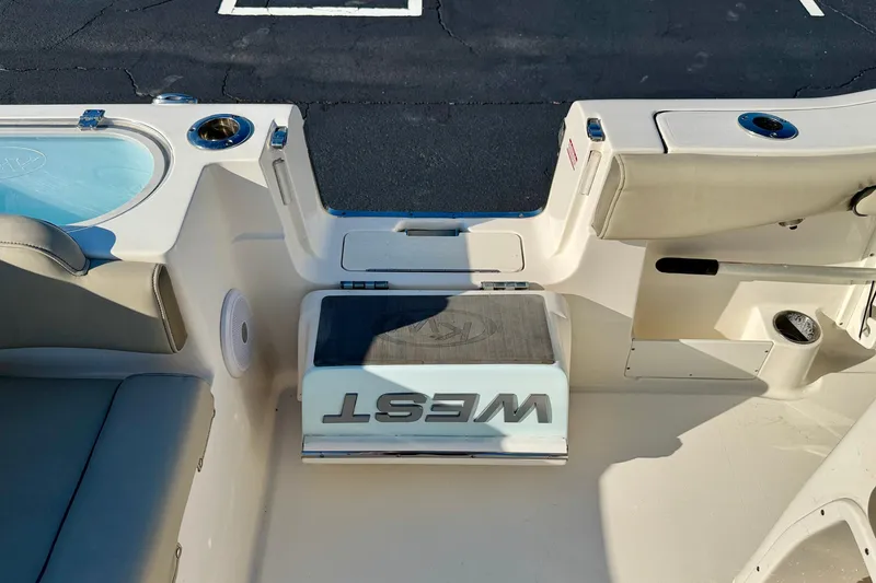 Slide: The Image of 2023 Key West 263 FS boat interior with seating and storage compartments. - 52