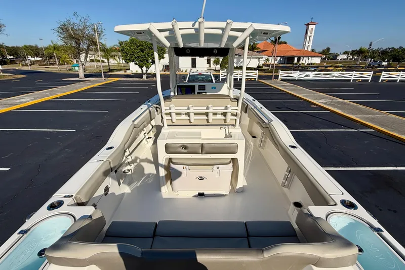 Slide: The Image of 2023 Key West 263 FS boat interior, spacious seating, and modern design in a parking lot. - 53