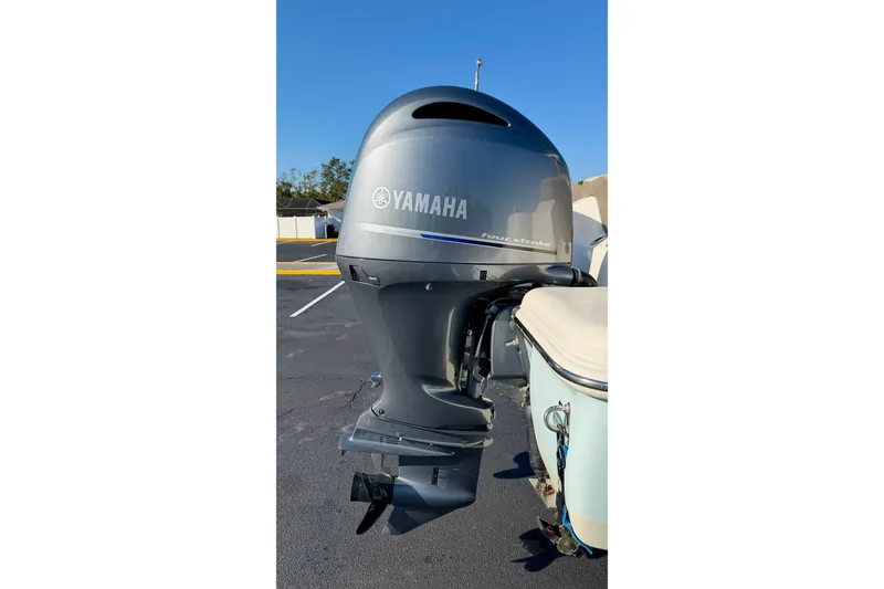 Slide: The Image of 2023 Key West 263 FS boat with Yamaha outboard motor in parking lot. - 58