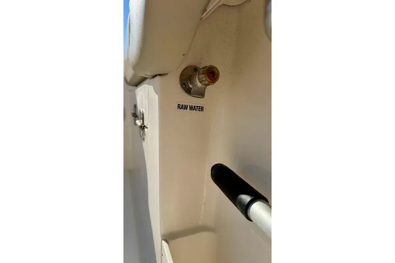 Slide: The Image of 2023 Key West 263 FS boat raw water outlet detail. - 59