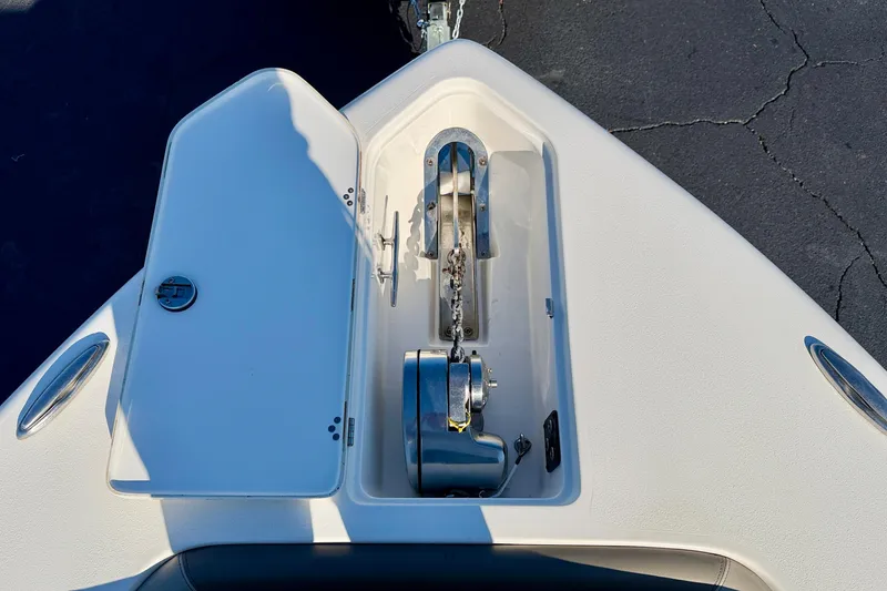 Slide: The Image of 2023 Key West 263 FS boat anchor compartment with open hatch. - 8