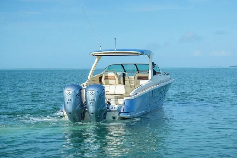 Slide: The Image of 2019 Chris-Craft Launch 35 GT OB boat on open water, featuring dual 425 V8 engines. - 1