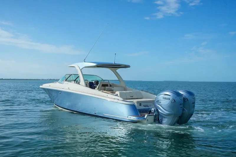Slide: The Image of 2019 Chris-Craft Launch 35 GT OB boat cruising on open water. - 11