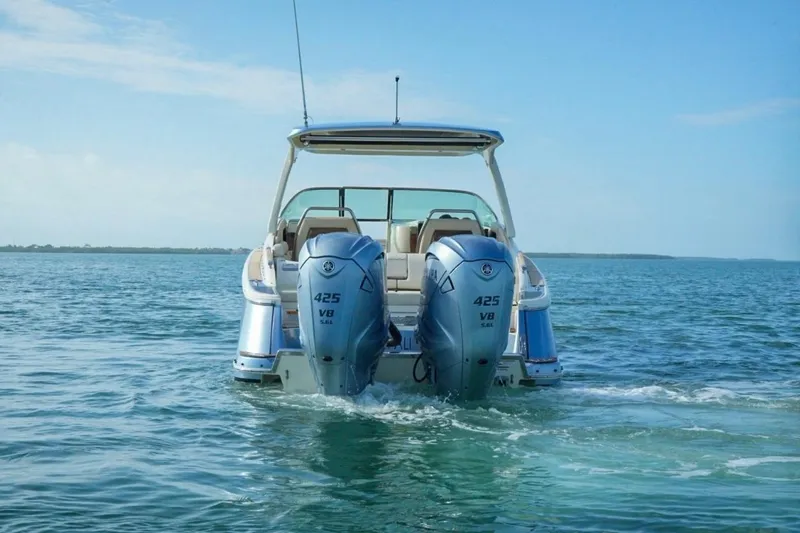 Slide: The Image of 2019 Chris-Craft Launch 35 GT OB with dual outboard engines on open water. - 12