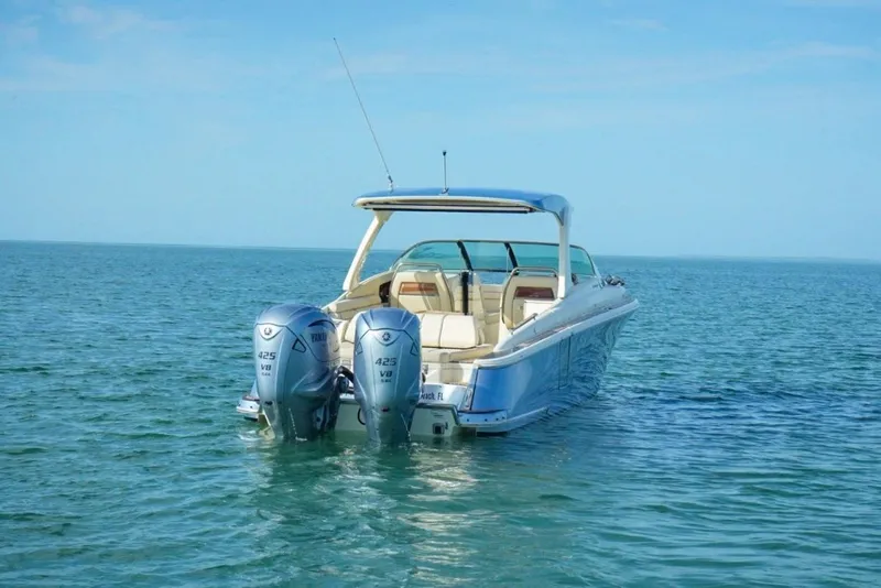 Slide: The Image of 2019 Chris-Craft Launch 35 GT OB boat with dual outboard engines on open water. - 15