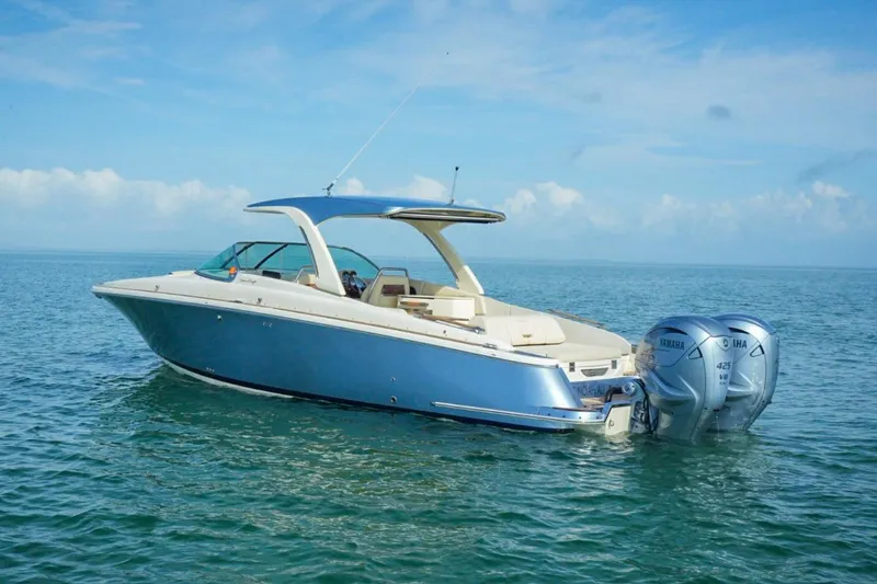 Slide: The Image of 2019 Chris-Craft Launch 35 GT OB boat on calm ocean waters. - 17
