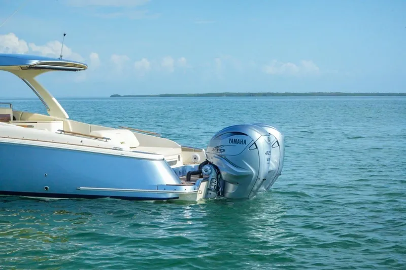 Slide: The Image of 2019 Chris-Craft Launch 35 GT OB with Yamaha outboard engine on calm water. - 18
