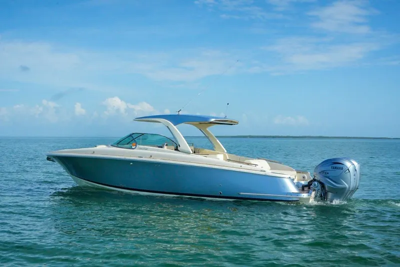Slide: The Image of 2019 Chris-Craft Launch 35 GT OB boat on calm ocean waters. - 19