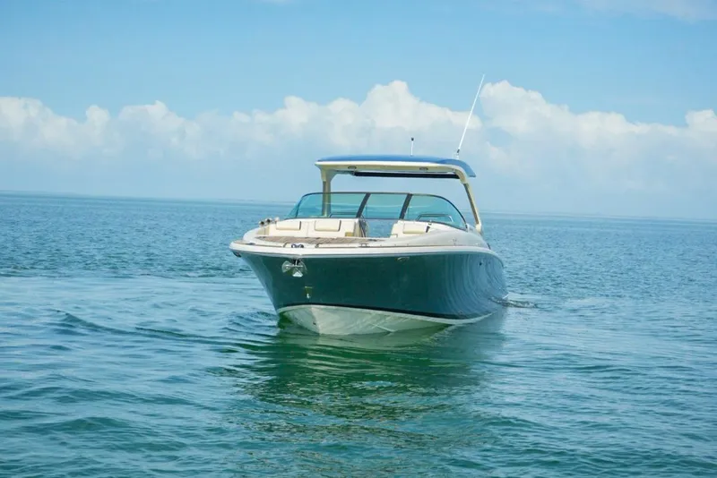Slide: The Image of 2019 Chris-Craft Launch 35 GT OB boat cruising on open water. - 21