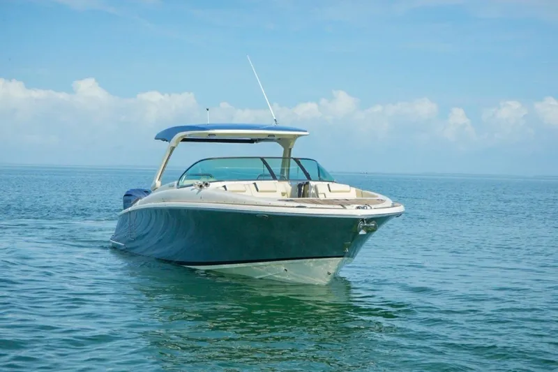 Slide: The Image of 2019 Chris-Craft Launch 35 GT OB boat on calm ocean waters. - 23