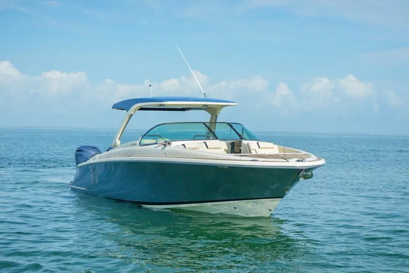 Slide: The Image of 2019 Chris-Craft Launch 35 GT OB boat on calm blue water. - 24