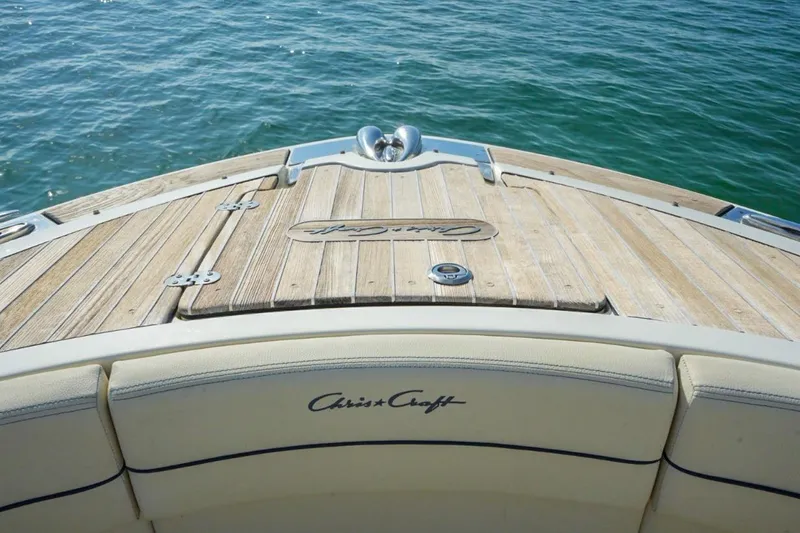 Slide: The Image of 2019 Chris-Craft Launch 35 GT OB boat deck with teak finish on water. - 28