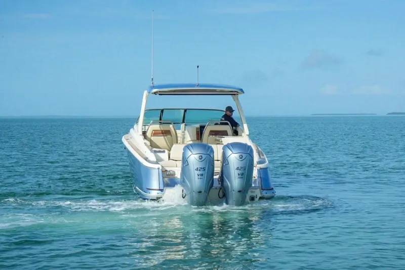 Slide: The Image of 2019 Chris-Craft Launch 35 GT OB cruising on open water with dual outboard engines. - 3