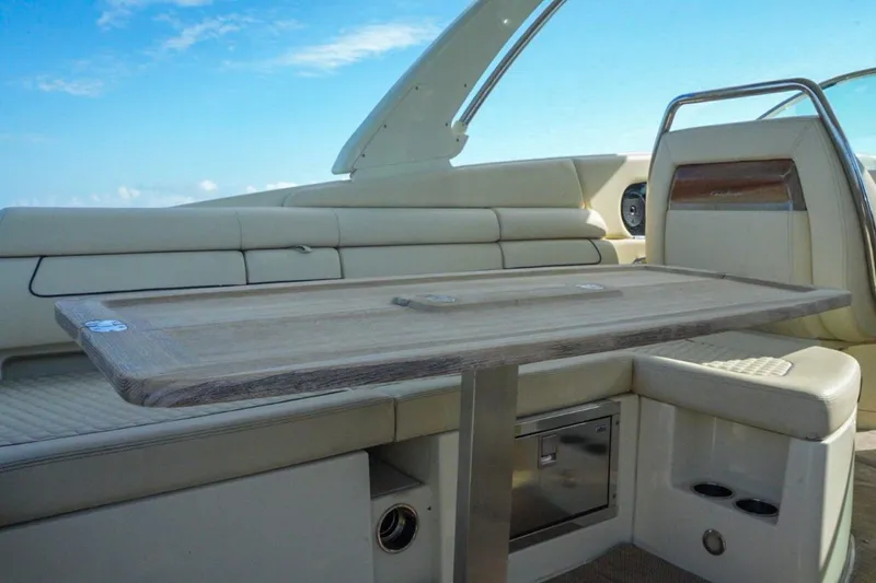 Slide: The Image of 2019 Chris-Craft Launch 35 GT OB interior with elegant seating and wooden table. - 31