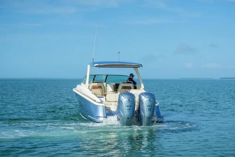 Slide: The Image of 2019 Chris-Craft Launch 35 GT OB cruising on open water with twin engines. - 4