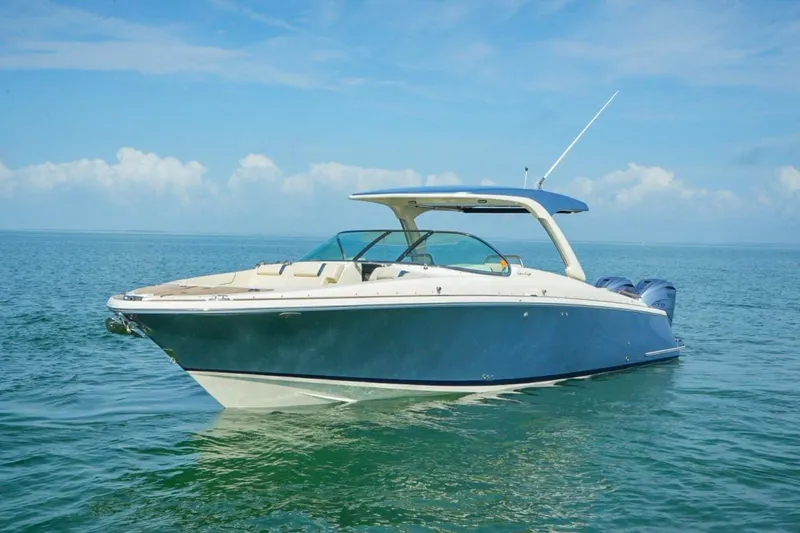 Slide: The Image of 2019 Chris-Craft Launch 35 GT OB boat on calm ocean waters. - 6