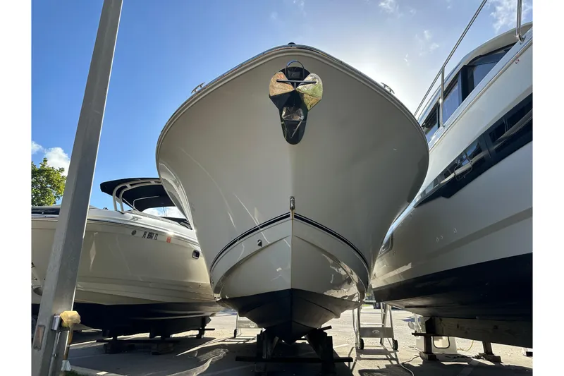 Slide: The Image of 2017 NauticStar 28 XS boat on display under clear blue sky. - 14