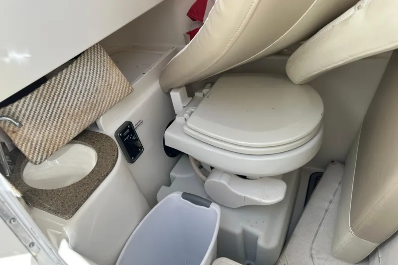 Slide: The Image of 2017 NauticStar 28 XS boat interior with compact bathroom amenities. - 5