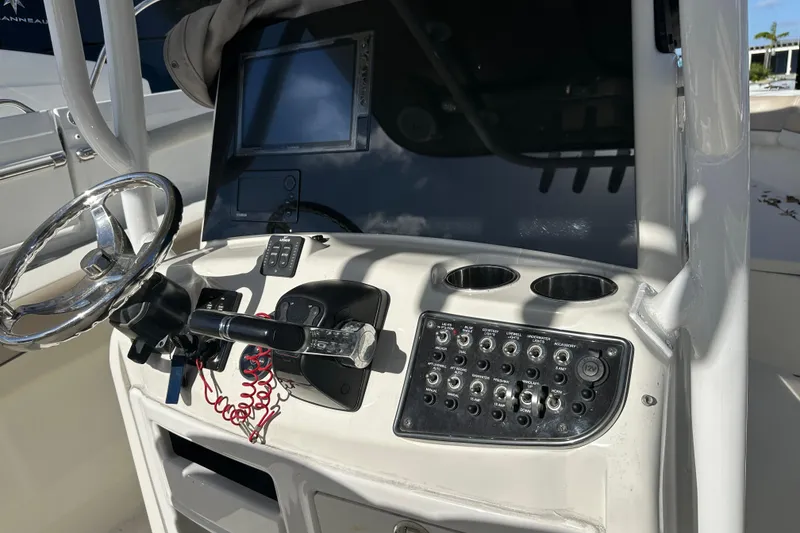 Slide: The Image of 2017 NauticStar 28 XS boat dashboard with steering wheel and control panel. - 6