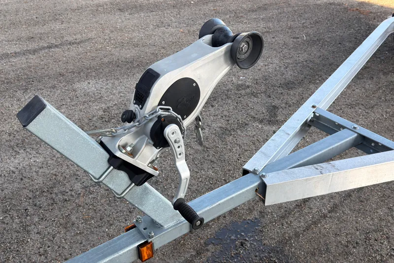 Slide: The Image of Boat trailer for 2020 Stingray 212 SC, featuring dual axles and Coastal Boat Pros branding. - 17