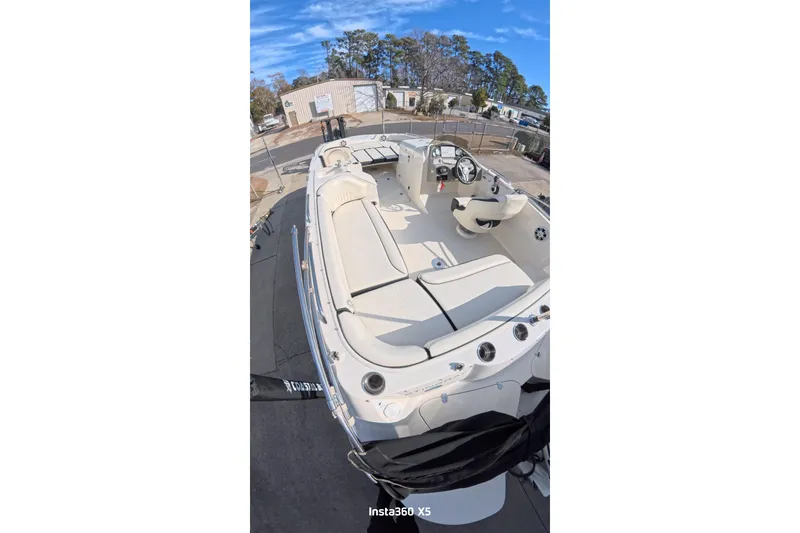 Slide: The Image of 2020 Stingray 212 SC boat with spacious seating and sleek design. - 19